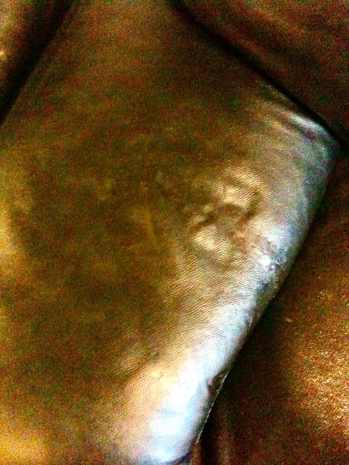 Leather Arm Tear Repair — after repair