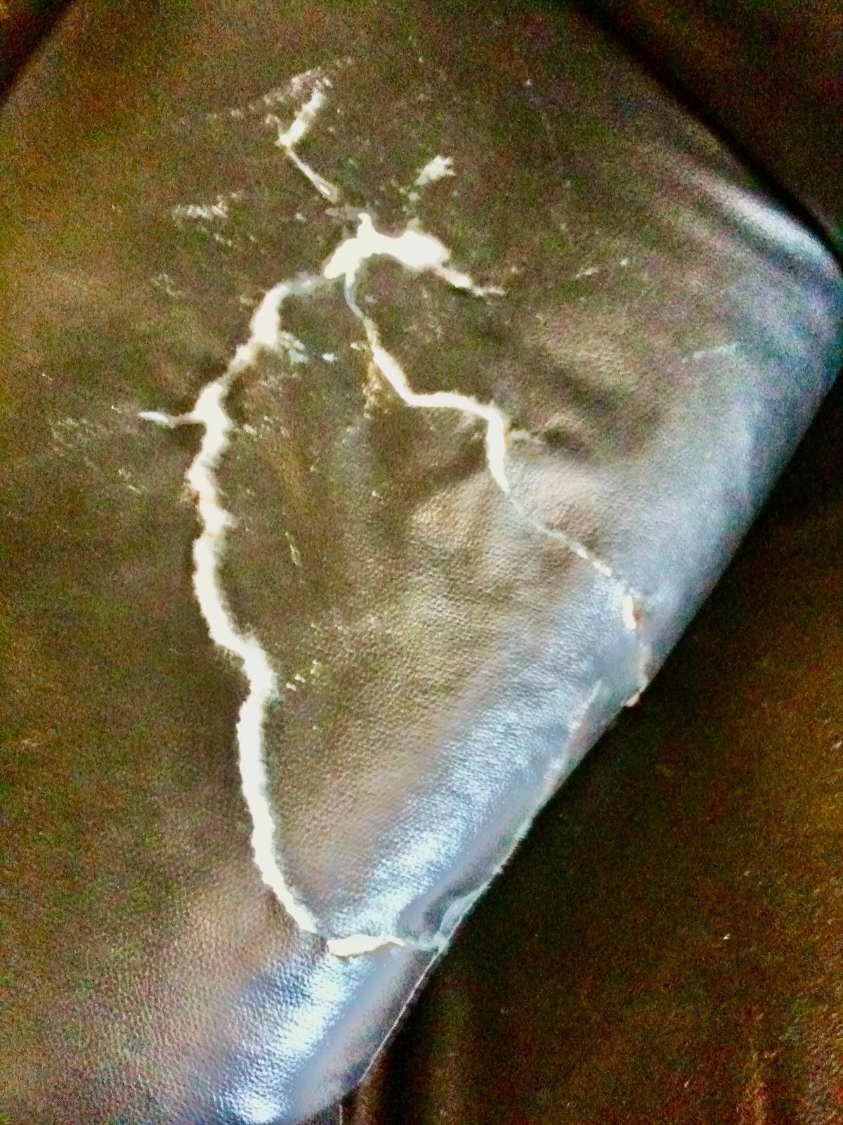 Leather Arm Tear Repair — before repair